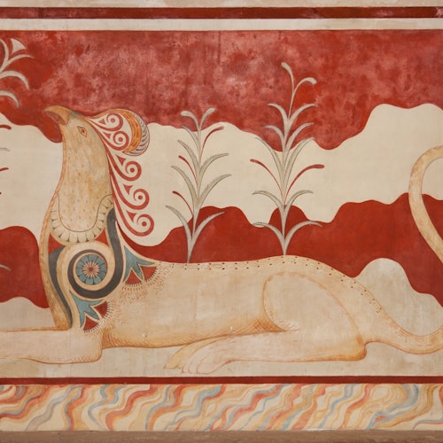 A stylized mural of a mythical lion-like creature with detailed patterns, surrounded by plants against a red background.