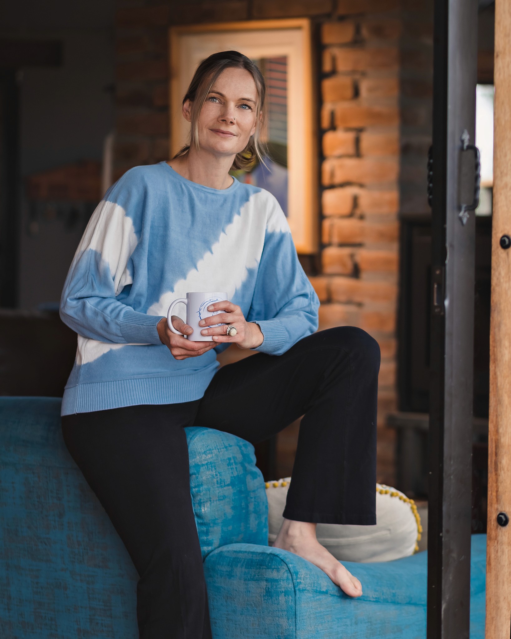 Portrait of Christina Marz with horses in a tranquil outdoor setting, symbolizing her connection to nature and Horse Guided Empowerment®.