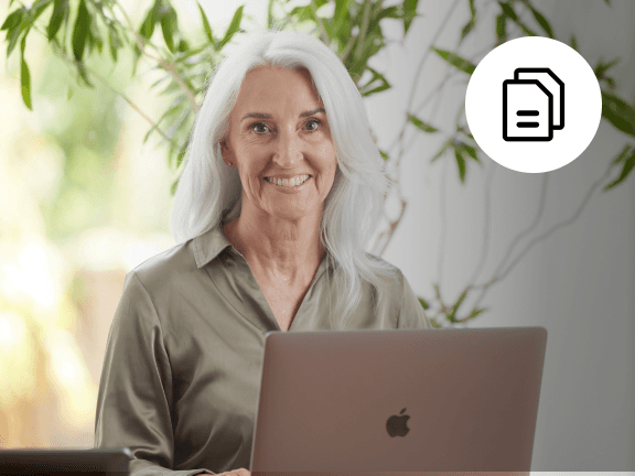 Female health and care manager working behind a laptop, symbolising transparency in workforce management pricing.
