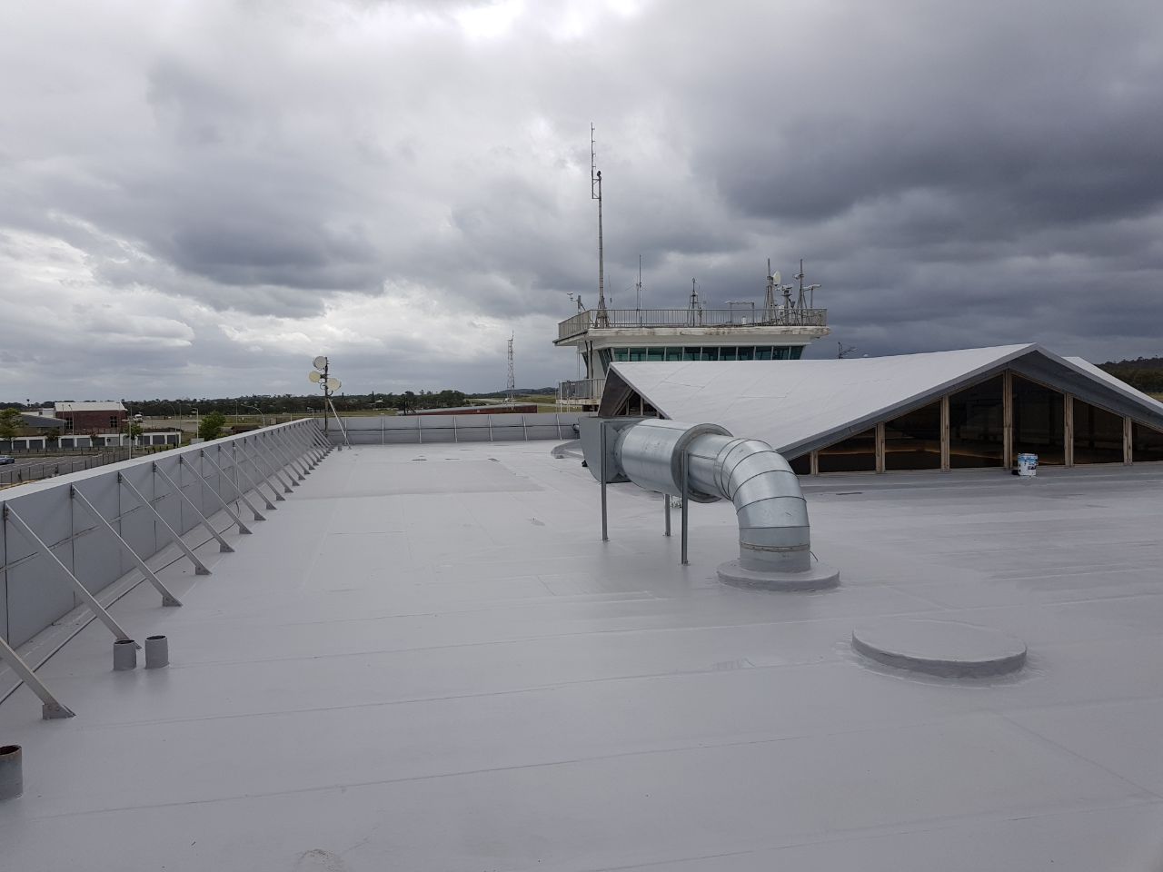 Industrial roof getting sprayed with waterproofiing rubber