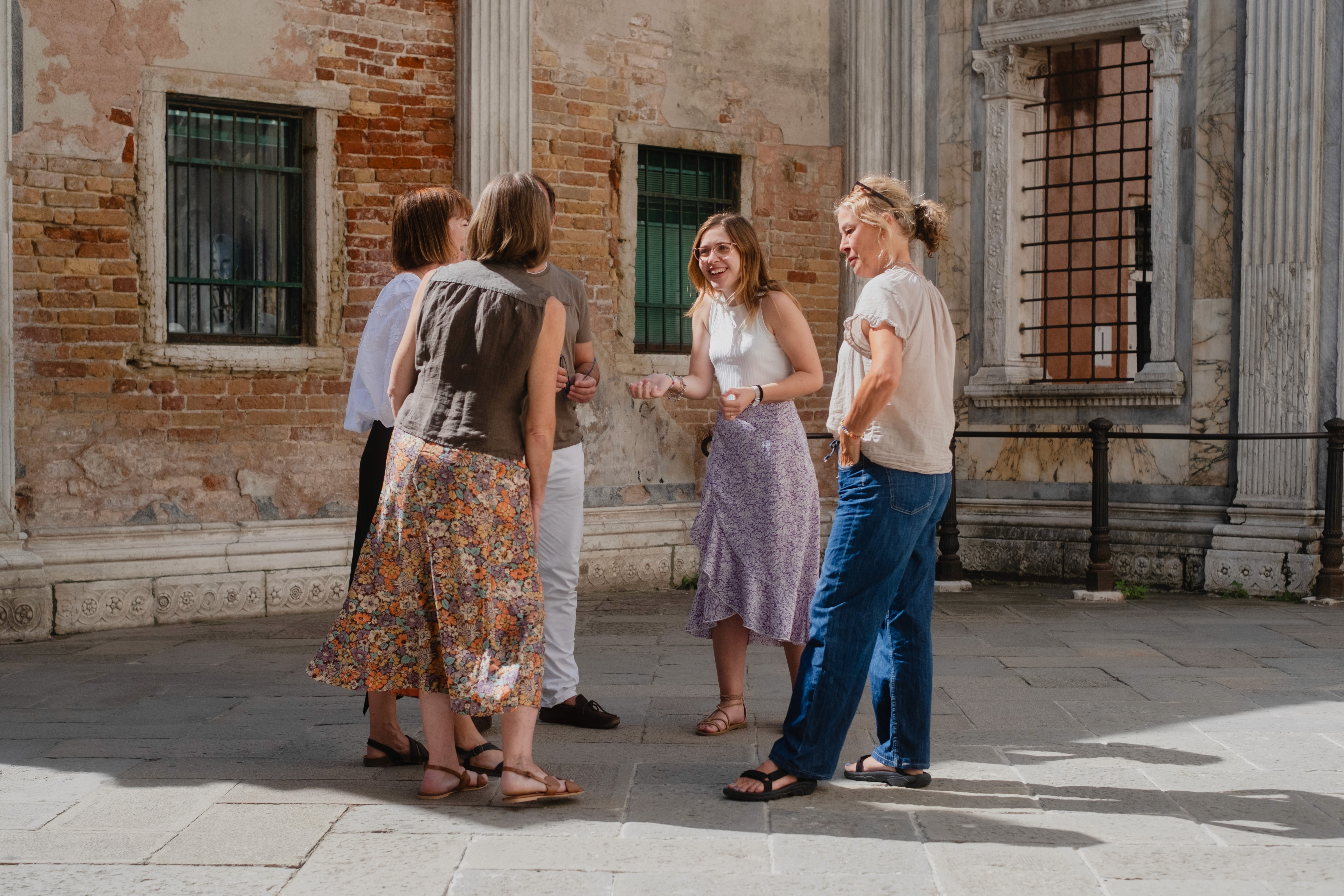 Teacher and students walking in Venice