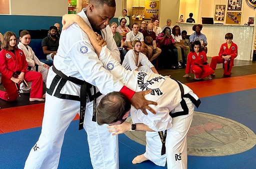 Mature man performing a self defense move.