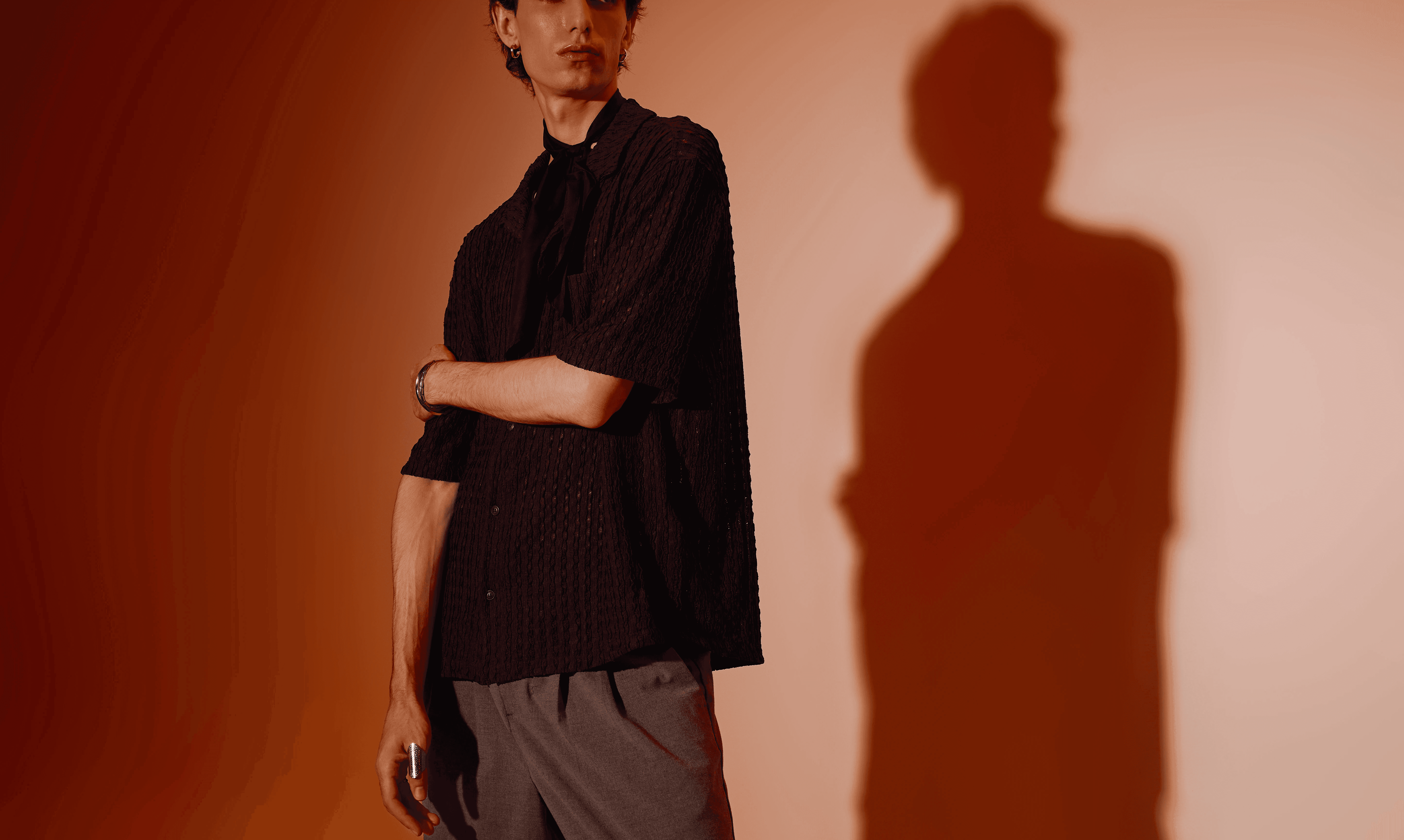 A surreal scene of blurred figures walking on a reflective surface, with a glowing horizontal light streak under a hazy sky.