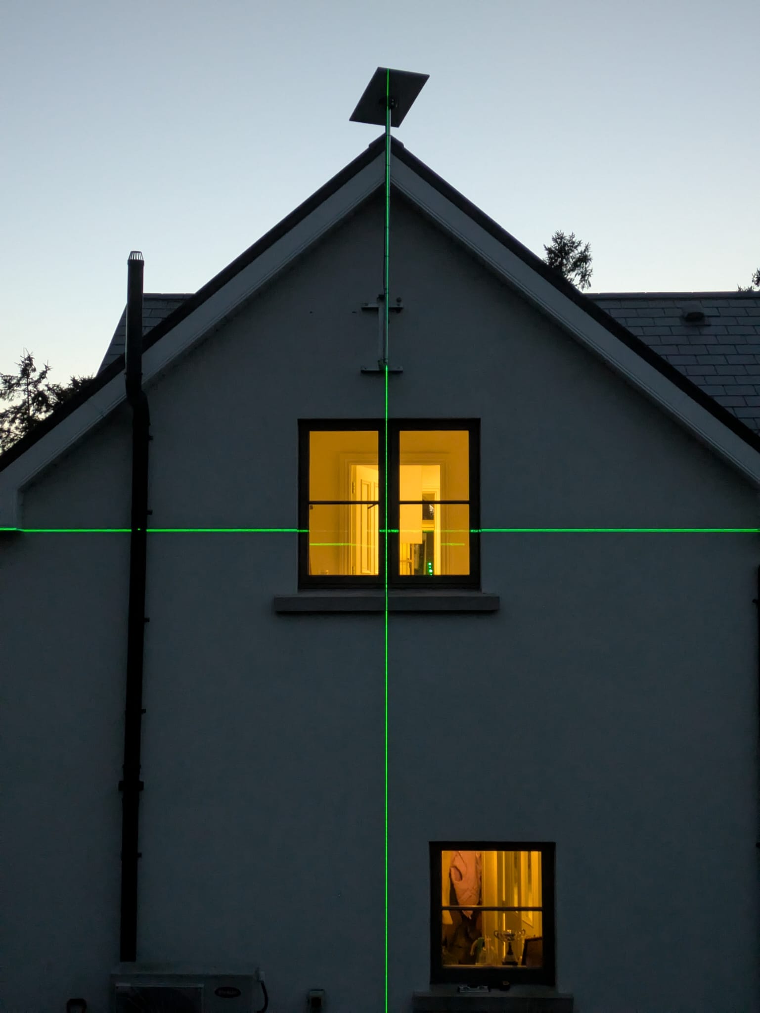 Starlink Installer using a lazer to alighn the dish in Ireland