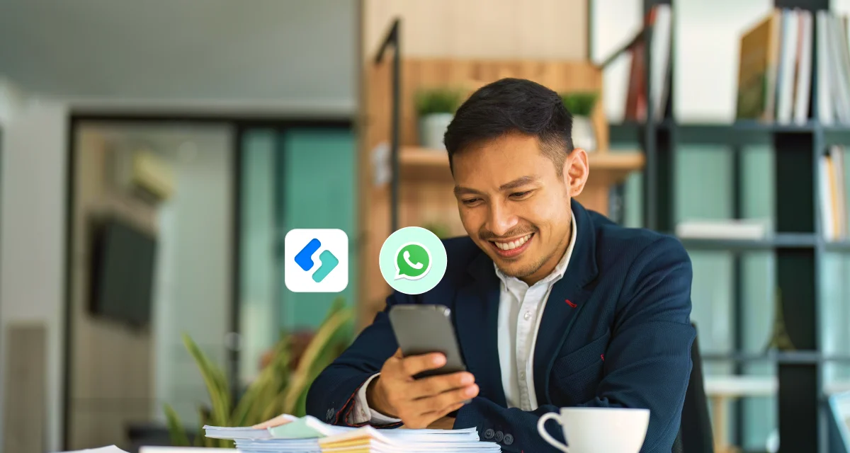 Malaysian business owner managing SME operations through WhatsApp on mobile phone