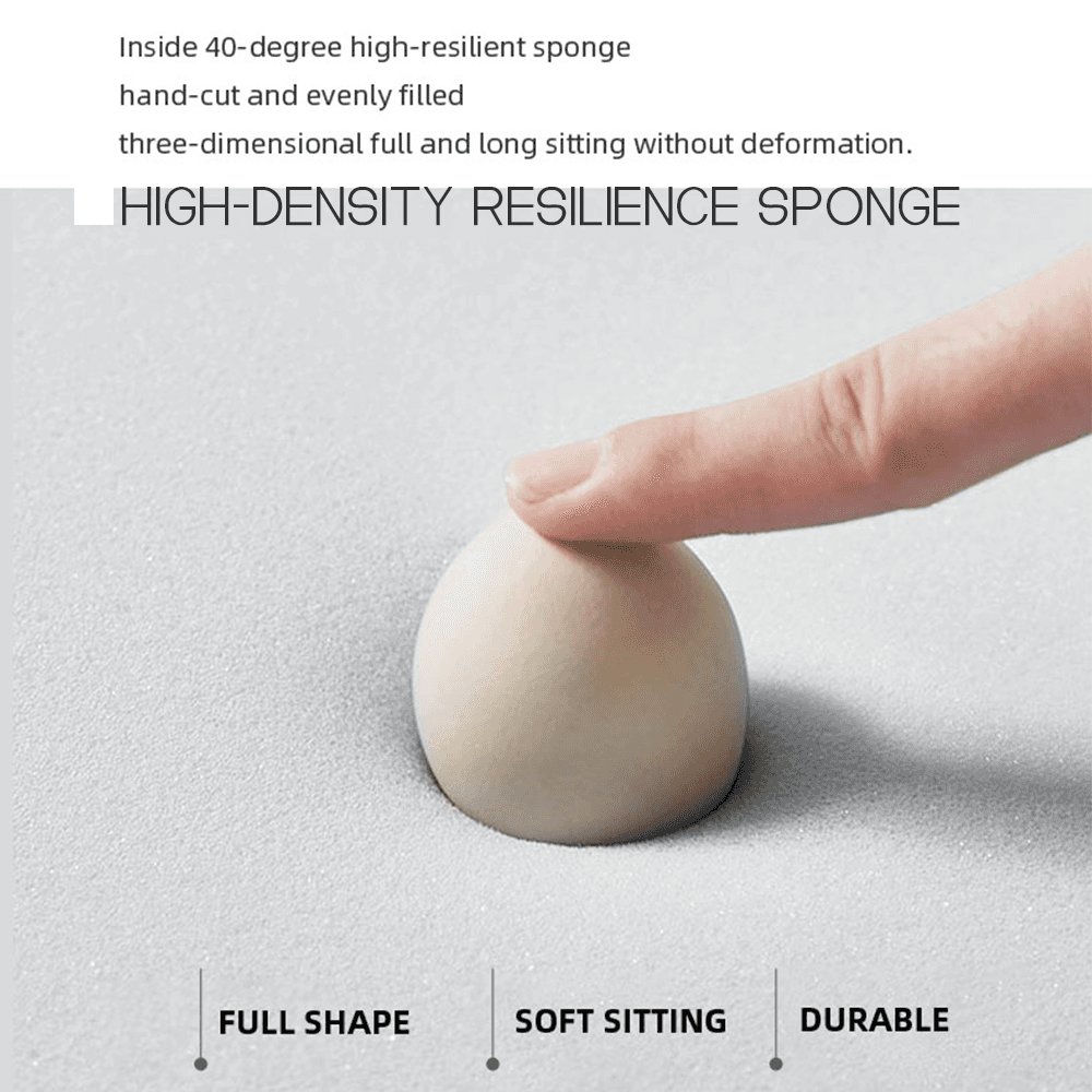 High-density 40-degree resilience sponge foam close-up: finger pressing into beige HR foam ball showing excellent bounce-back, shape retention, soft comfort, and durability for sofa cushions