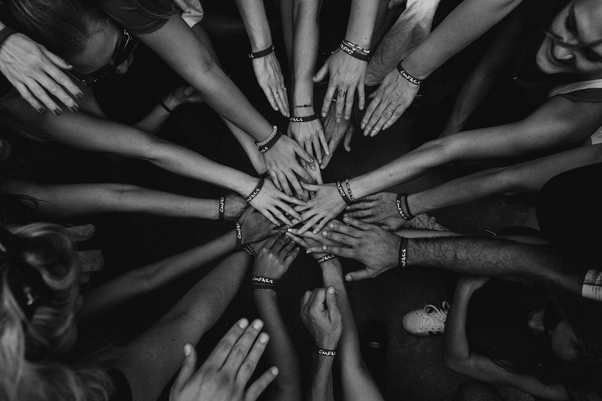 a group of people holding hands