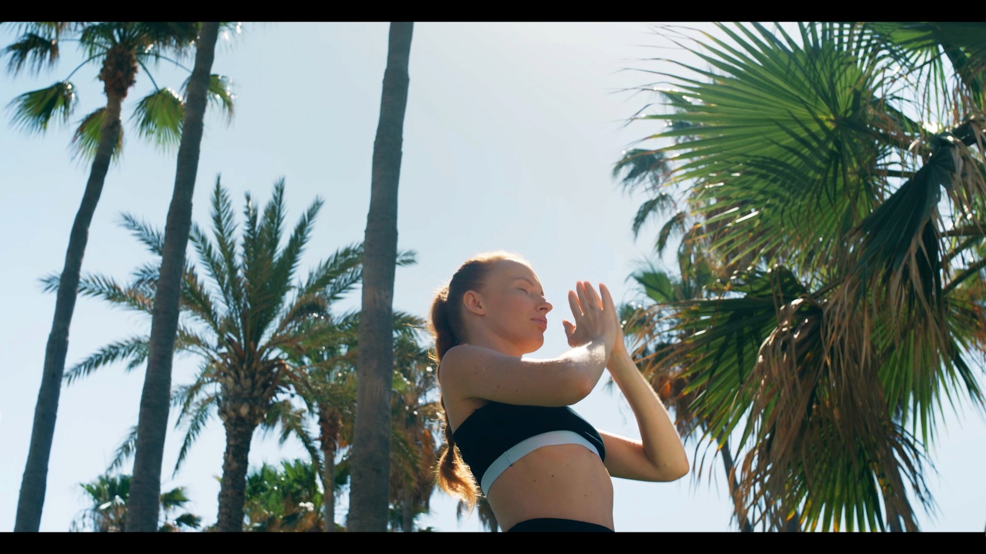 Woman is making Yoga during the filming of the official video of Leornardo Hotel in Pafos