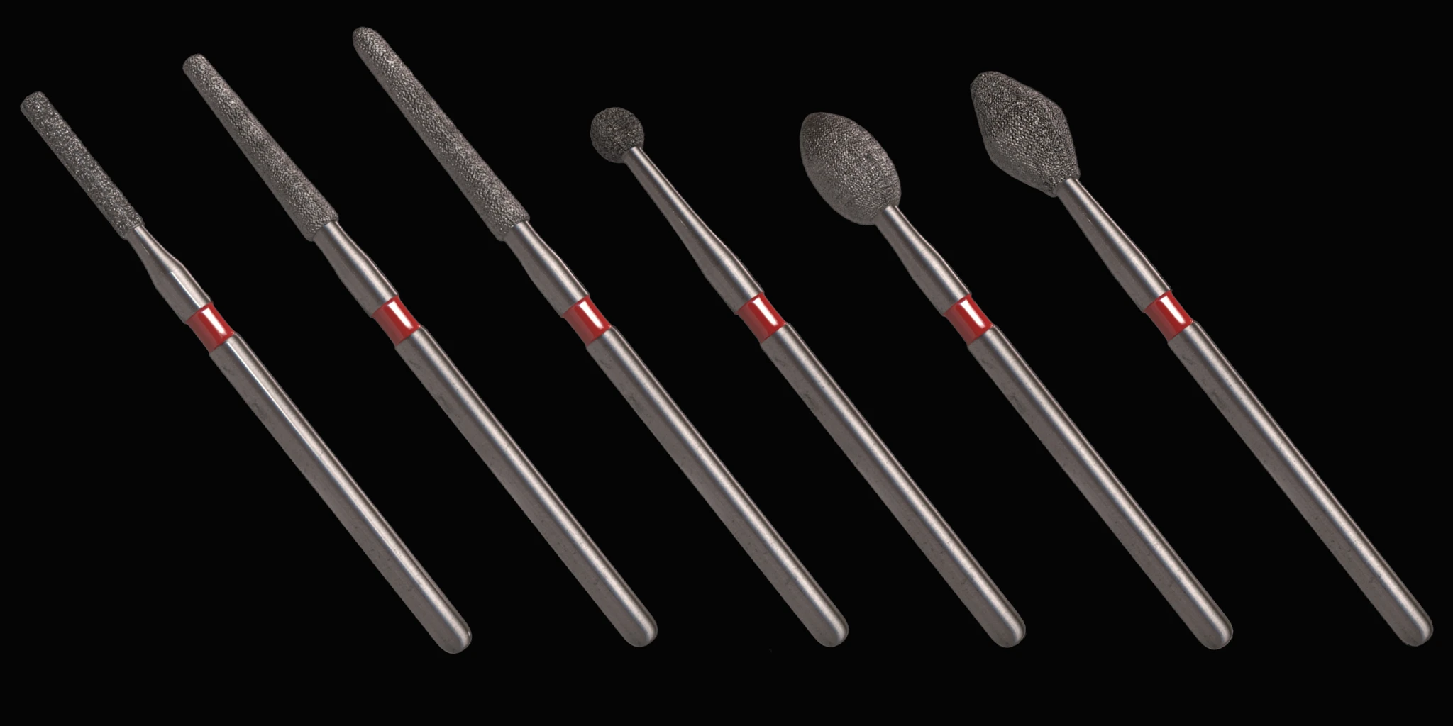 A set of six variously shaped paintbrushes arranged in a row against a dark background.