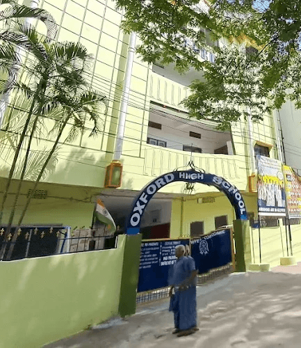 Modern campus courtyard with trees and academic buildings