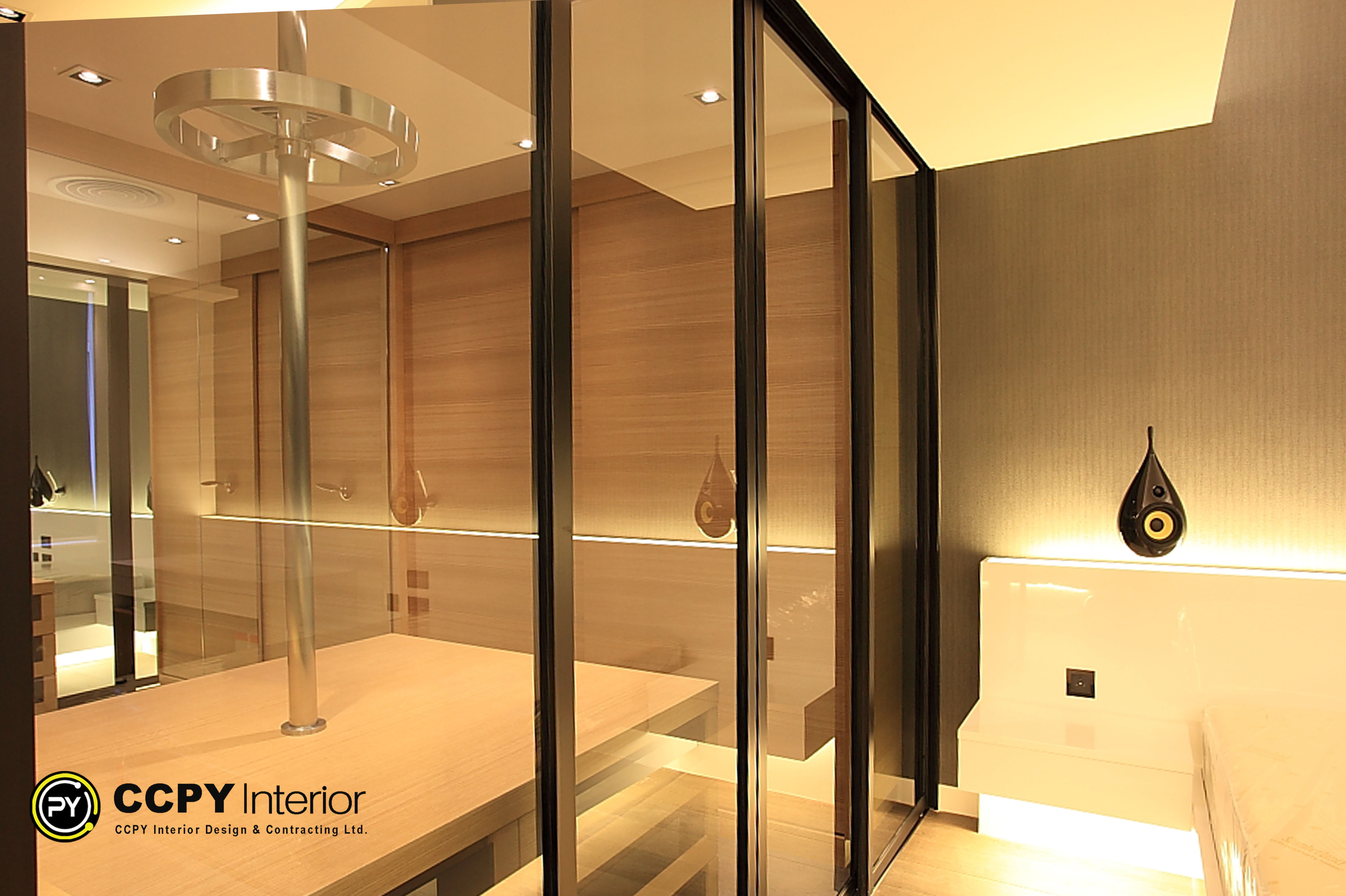 Architectural perspective from the sleeping area towards the glass walk-in closet at Standalone House, Perkins Road highlighting structural lines and transparent spatial transitions.