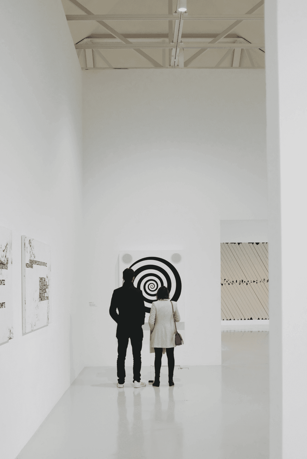 Visitors looking at art paintings