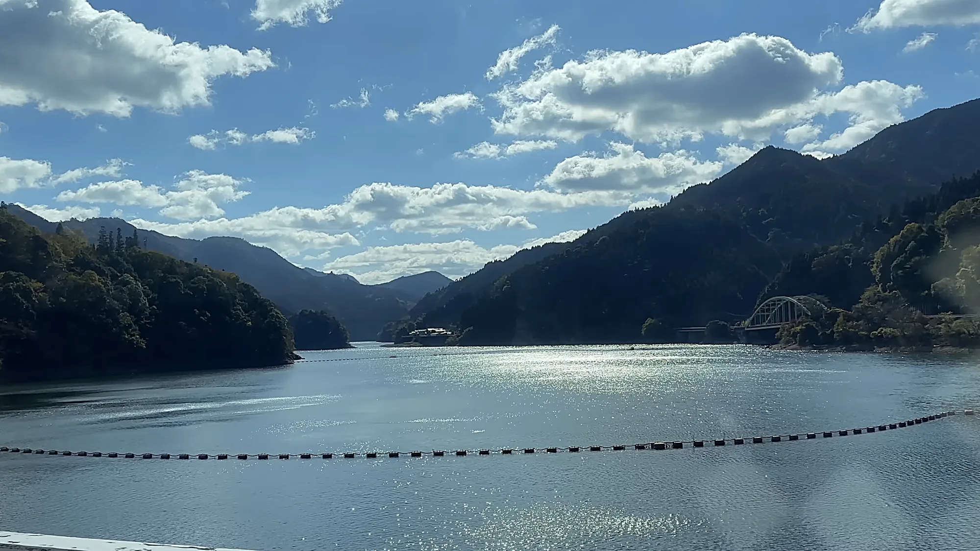 A reservoir between wooded ridges near Kurokawa Onsen
