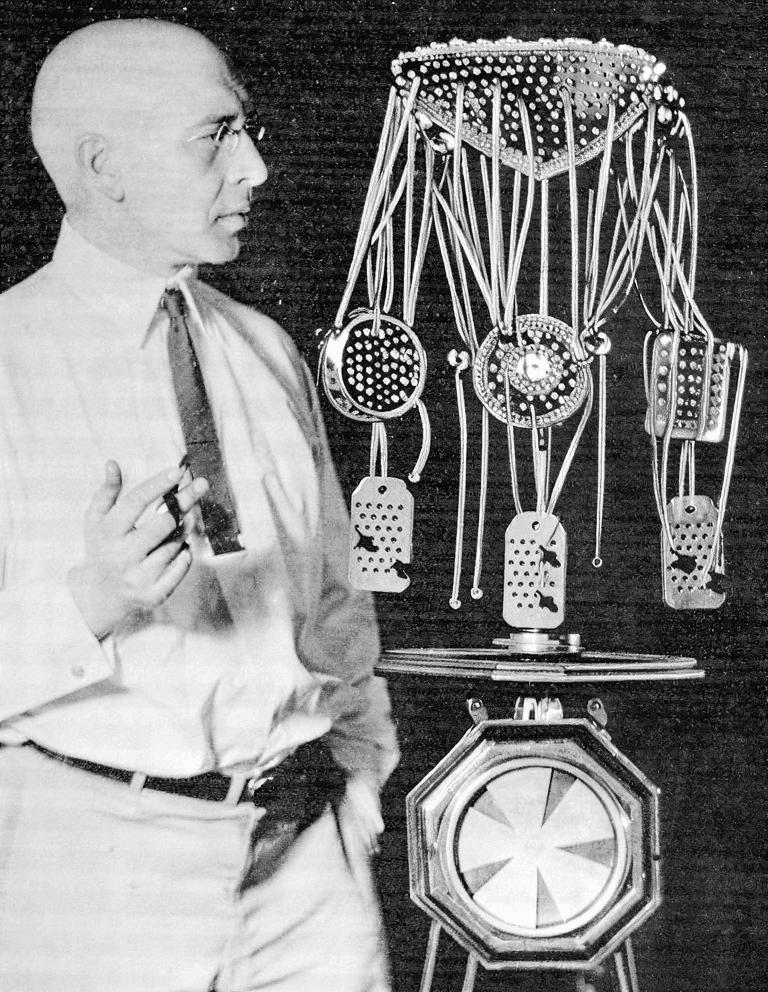 person in orange long sleeve shirt writing on white paper