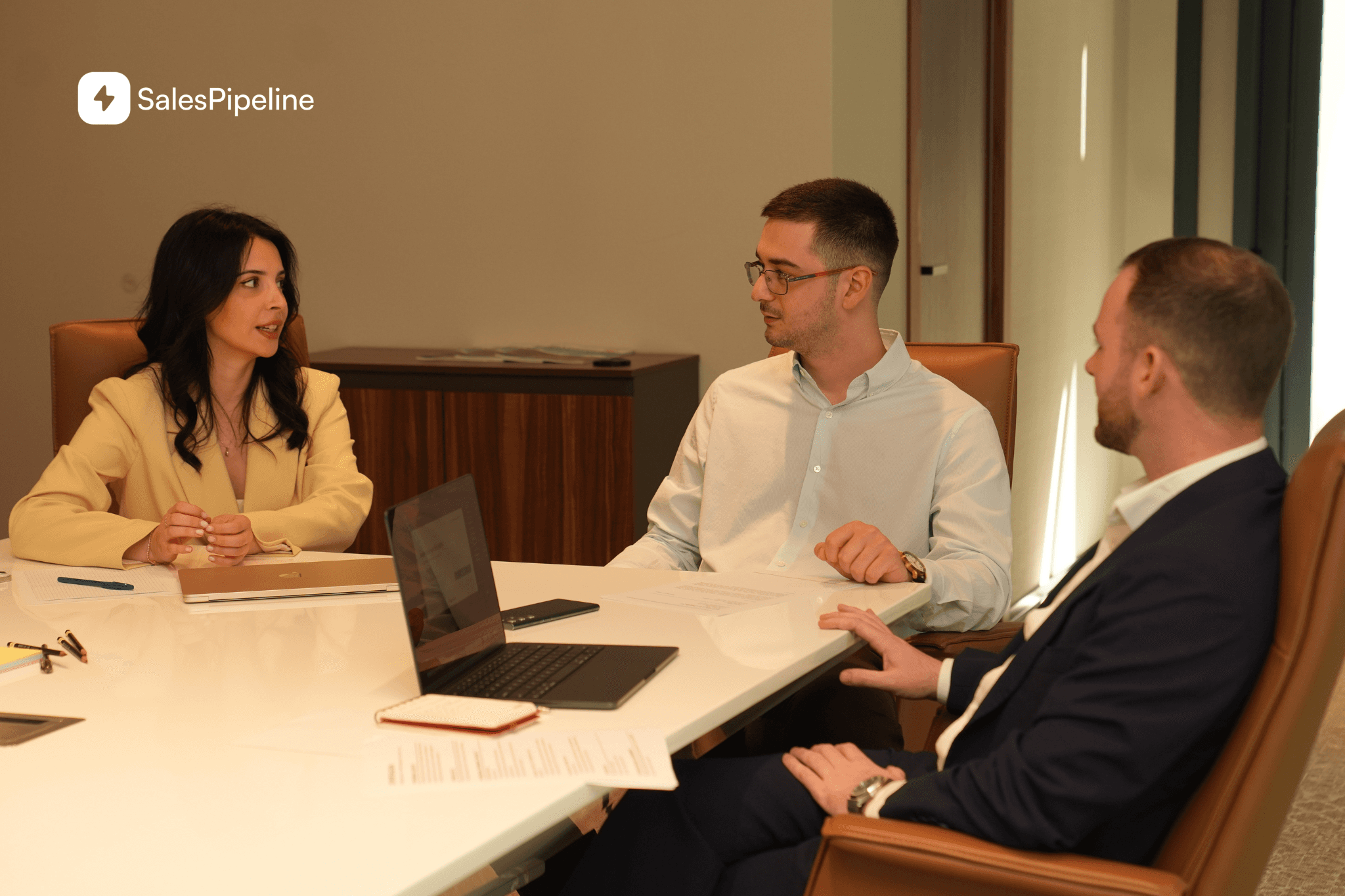 A handoff from business development to a specialist, carrying the buyer-confirmed problem, open decision, relevant people and agreed next step.
