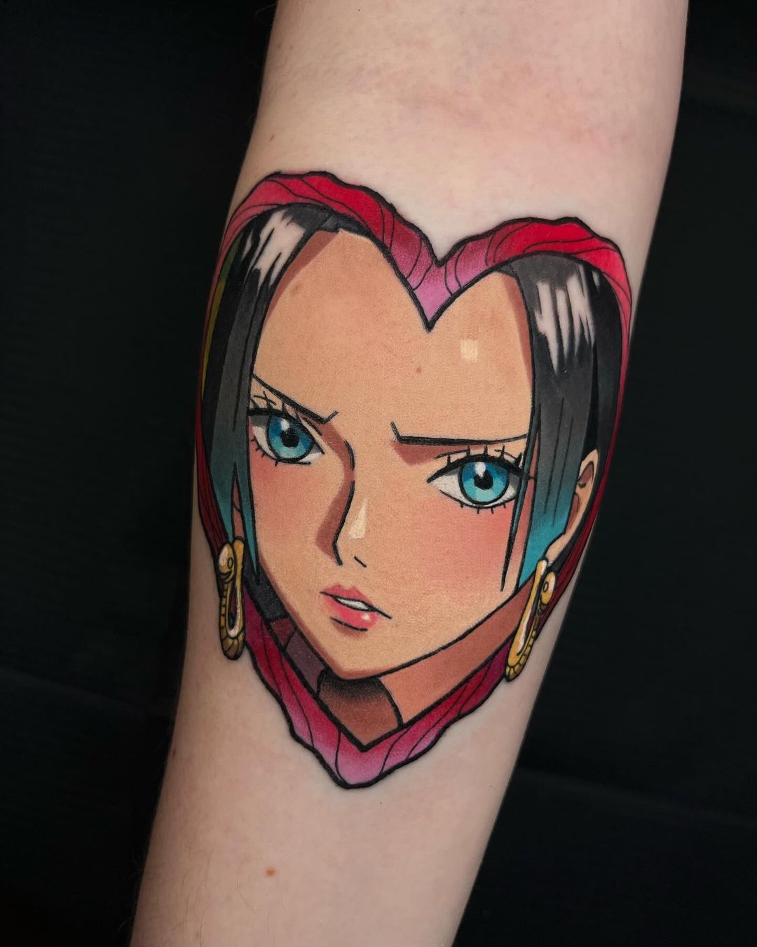 A tattoo of Boa Hancock by Rhur Tattoos, presenting her in a dynamic action pose, ready to unleash her powerful abilities with vibrant colors and flowing lines