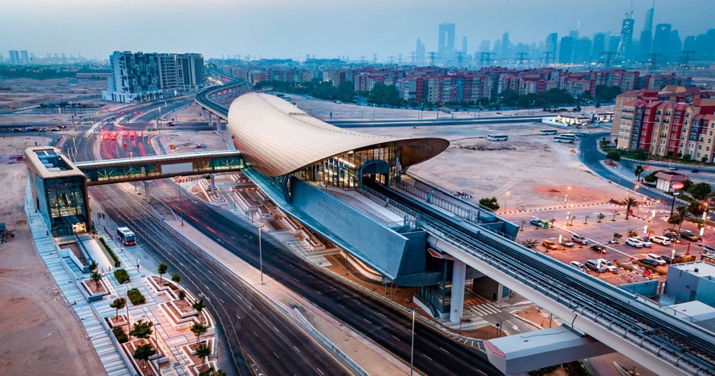 Mira Oasis 3 metro station entrance with modern architecture and clear signage, surrounded by greenery and urban landscape.
