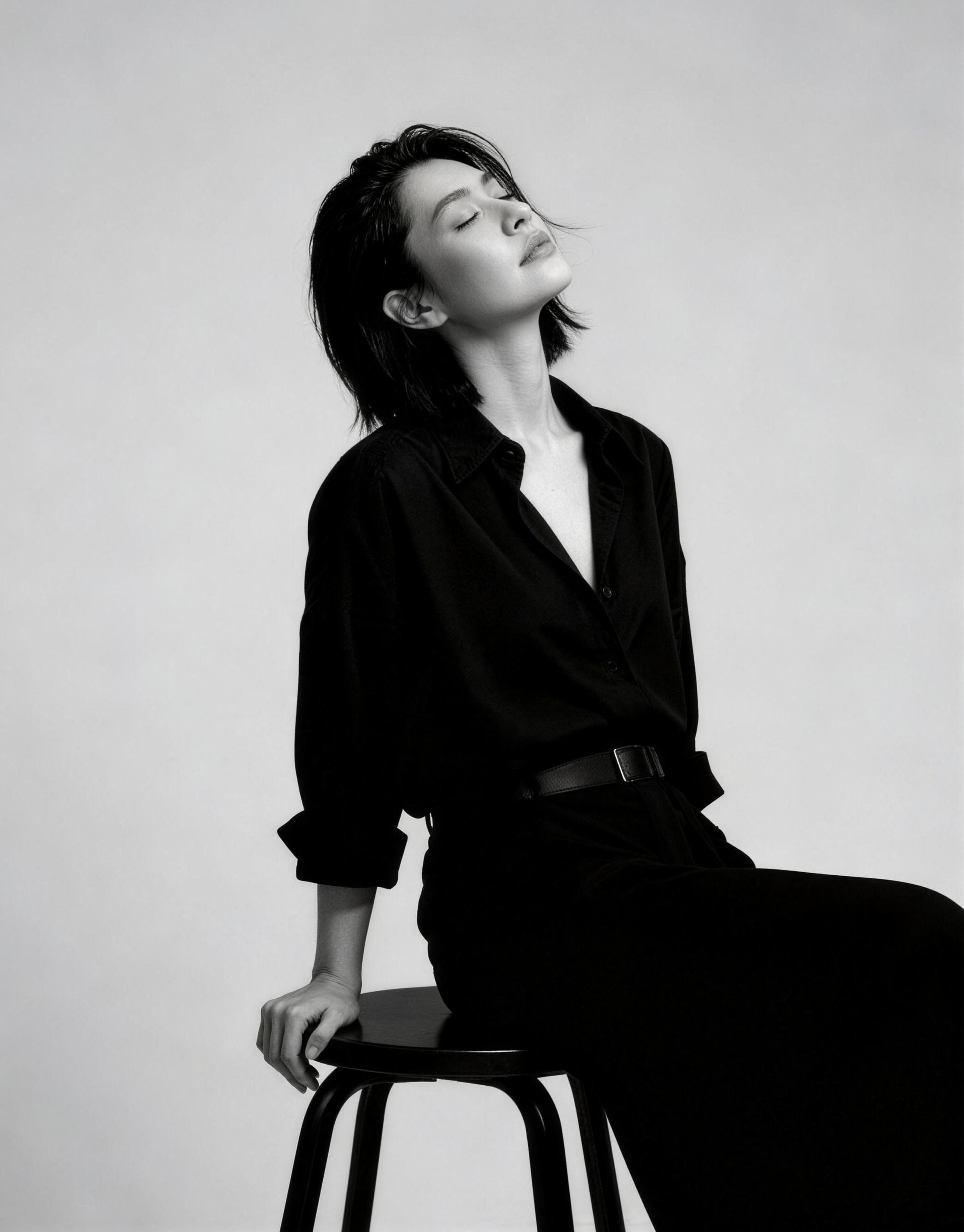 Minimalist black and white portrait photography woman sitting by Lefty Studio