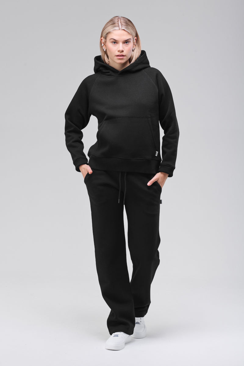 Sunday Superior Belmont Hoodie in clean black, front walking pose