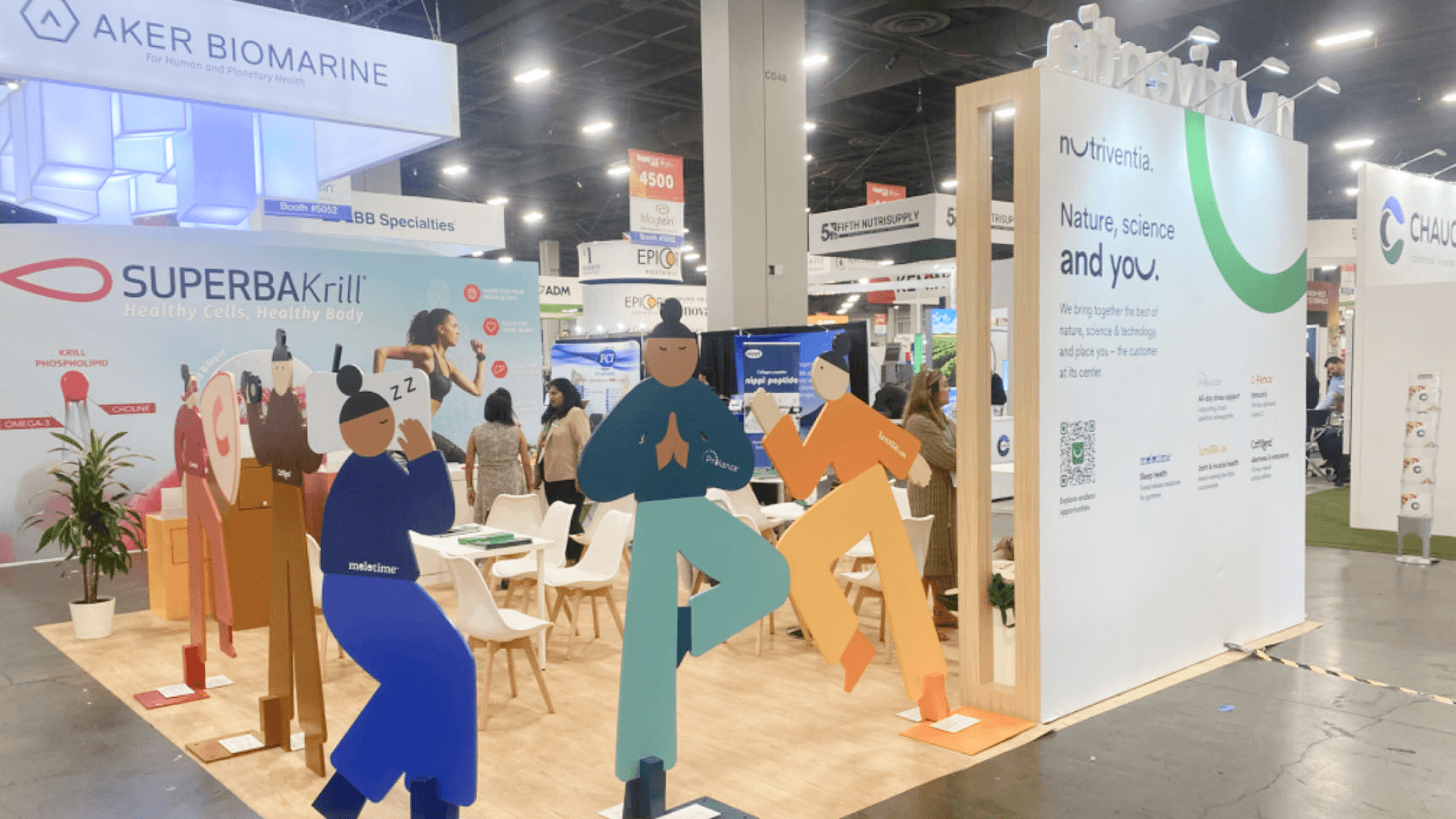 SupplySide nutraceutical booth with supplement display wall, product packaging, and clear visitor-facing presentation