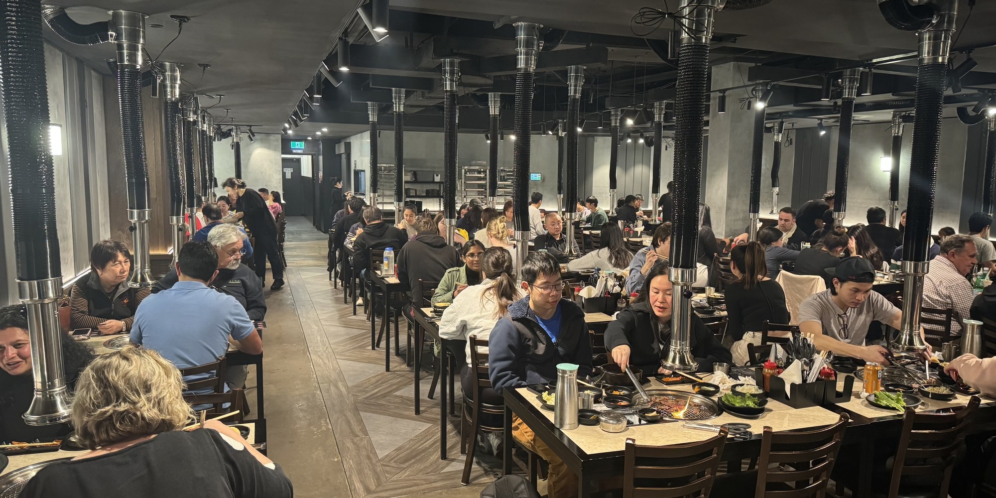 Busy dining hall at Stoneage Korean BBQ Hurstville