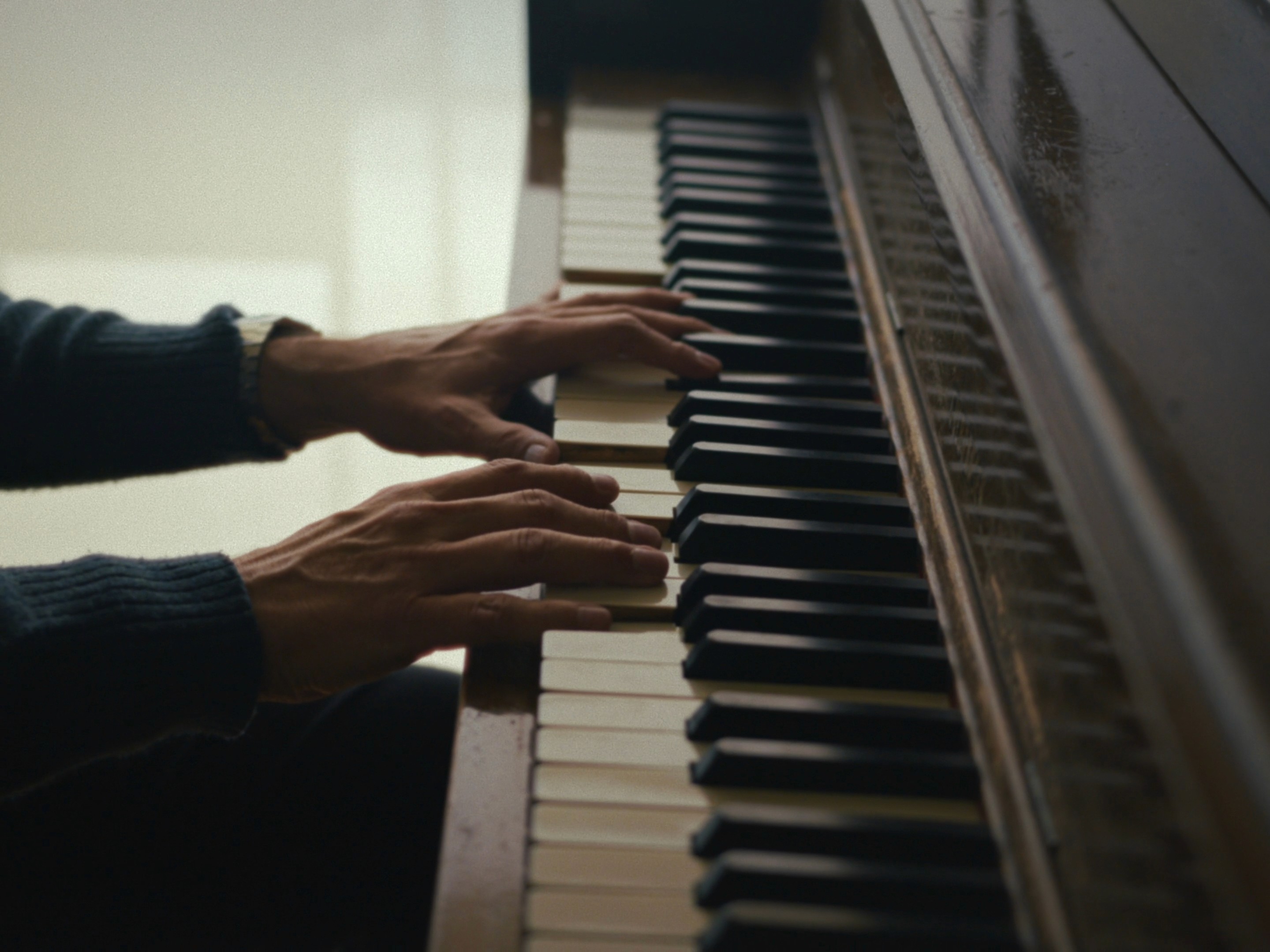 Cinematic close-up of Bellas Artes concert pianist Mauricio Nader Schekaiban playing the keys. Photographed by Mexico City DP Mauricio Nader for the documentary 'Una vida tocando piano' using a Blackmagic Pocket 6K G2 and Sigma 18-35mm lens.