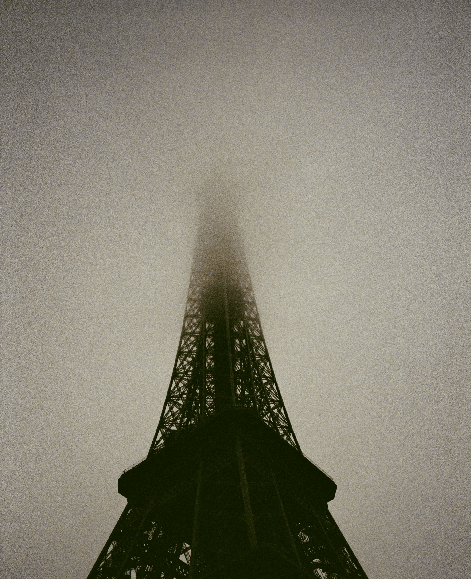 Eiffel tower shrouded in thick fog