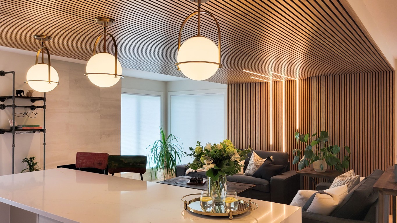 Image of Luxurious living room interior design with sofa, furniture, and pendant lights by KHD Homes design-build.