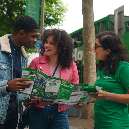 Three people looking at a map