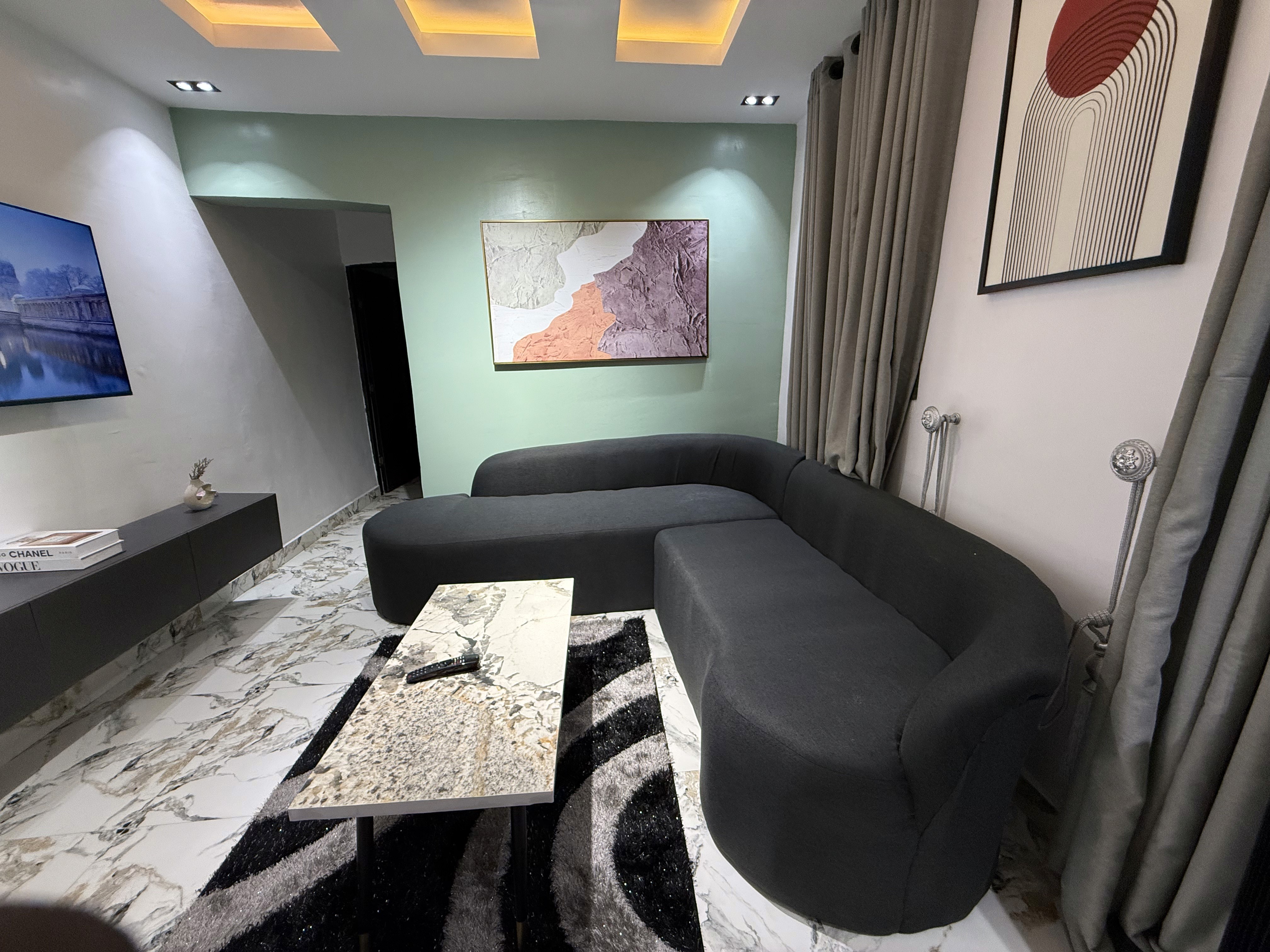 Stylish living room interior at Olive The Crest, serviced apartment shortlet in Yaba, Lagos
