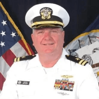 Portrait of Kevin Hanley, a smiling man in a U.S. Navy dress uniform