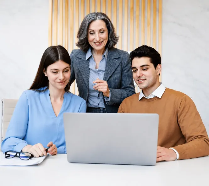 Business professionals reviewing referral rewards and payment information together in an office.