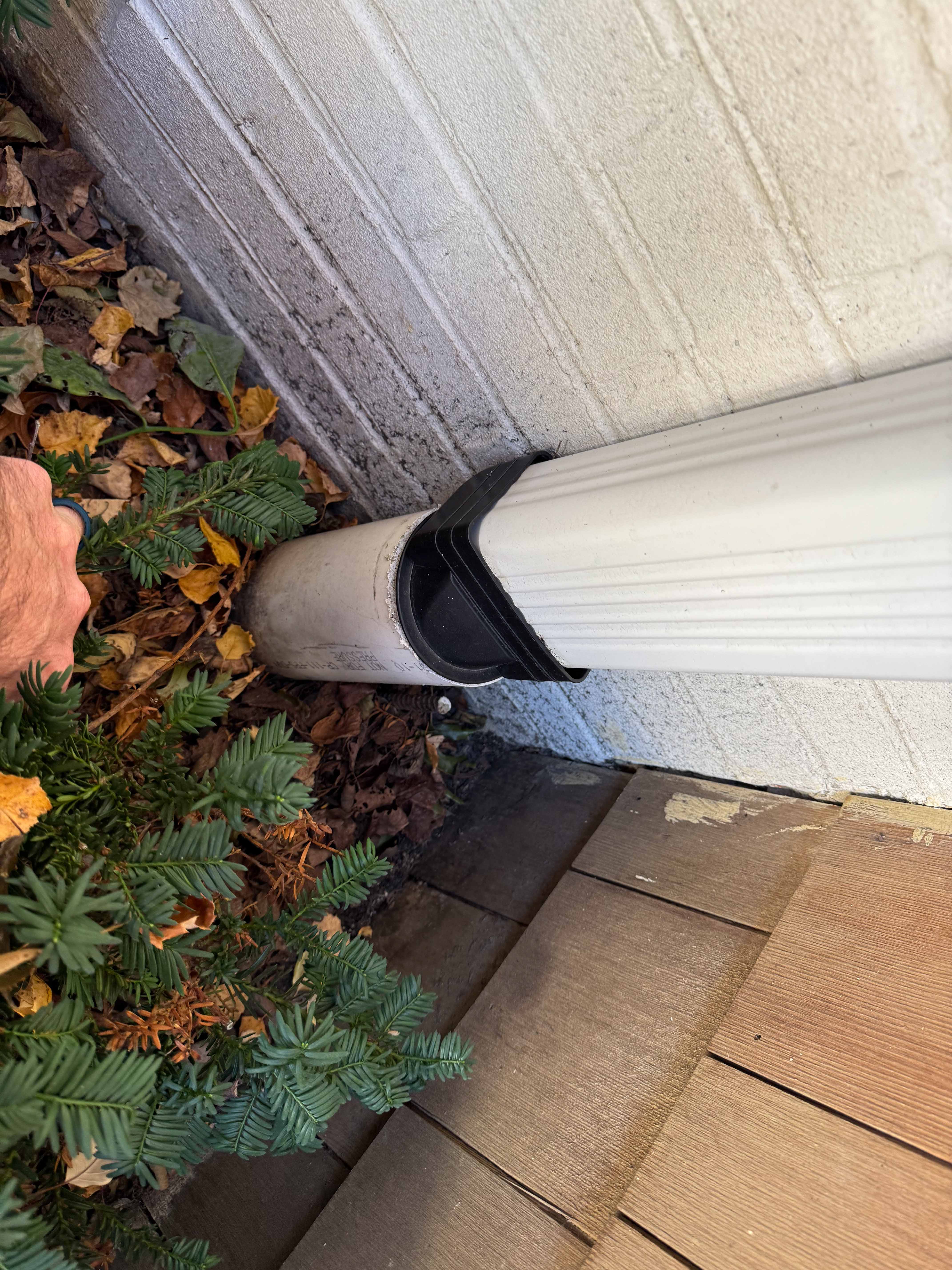 Updated drainage system with exposed PVC pipe