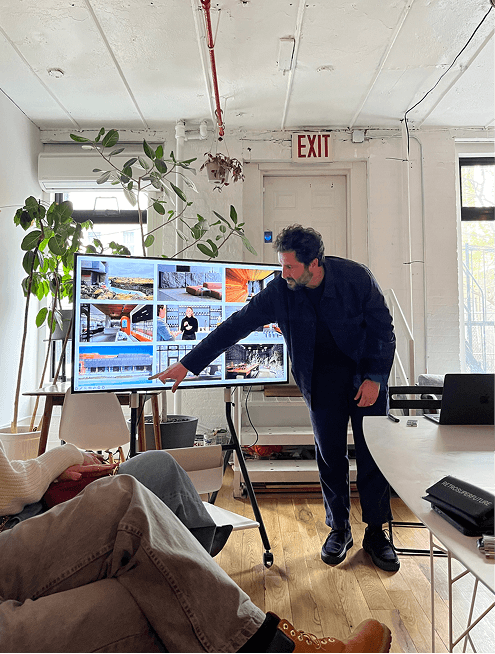 A designer presenting to VIVID students in a New York studio
