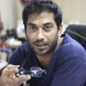 Middle age indian man in blue navy t-shirt