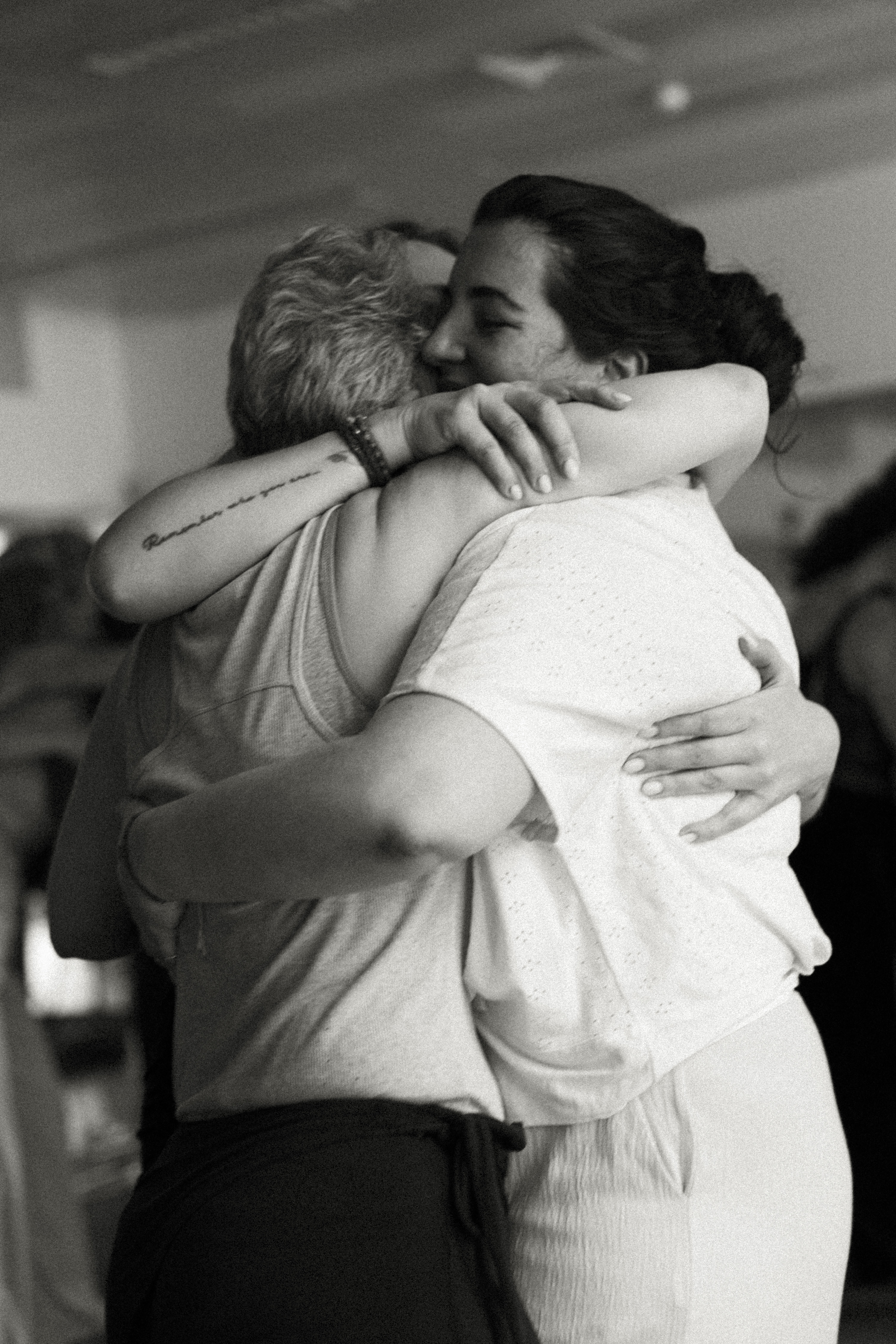 A person stands in a sandstone cave.