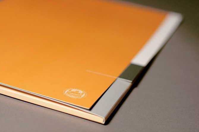an image of a orange stationery folder from a psychology university