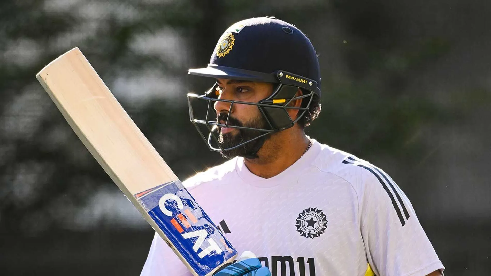 Rohit Sharma with bat in practice kit