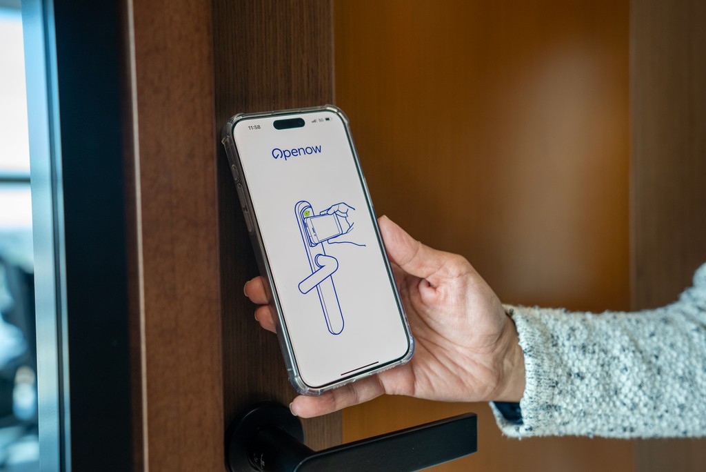 Digital keycard access via smartphone inside a coworking space in Abu Dhabi.