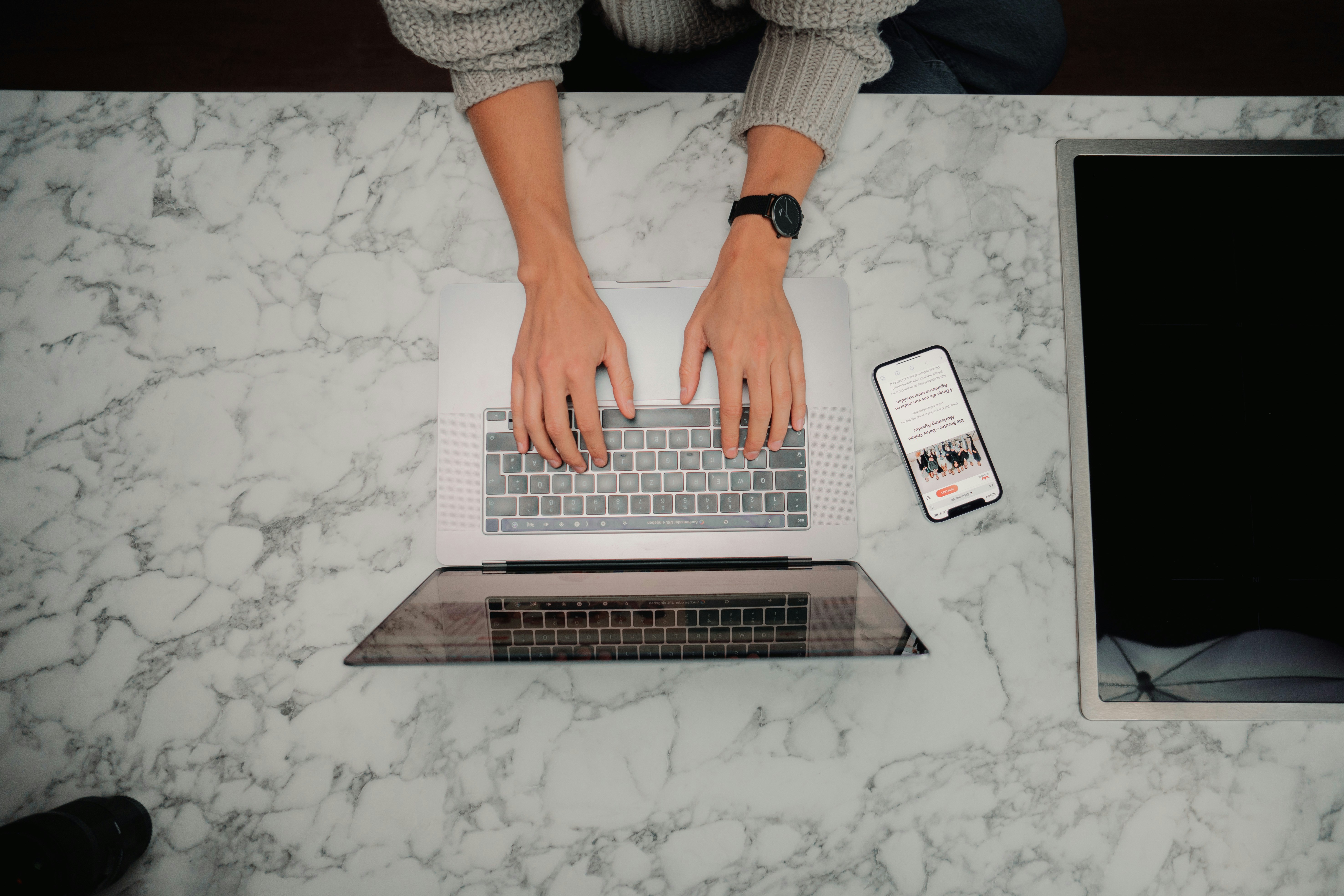 person working hard on laptop - Outlook Auto Delete Emails