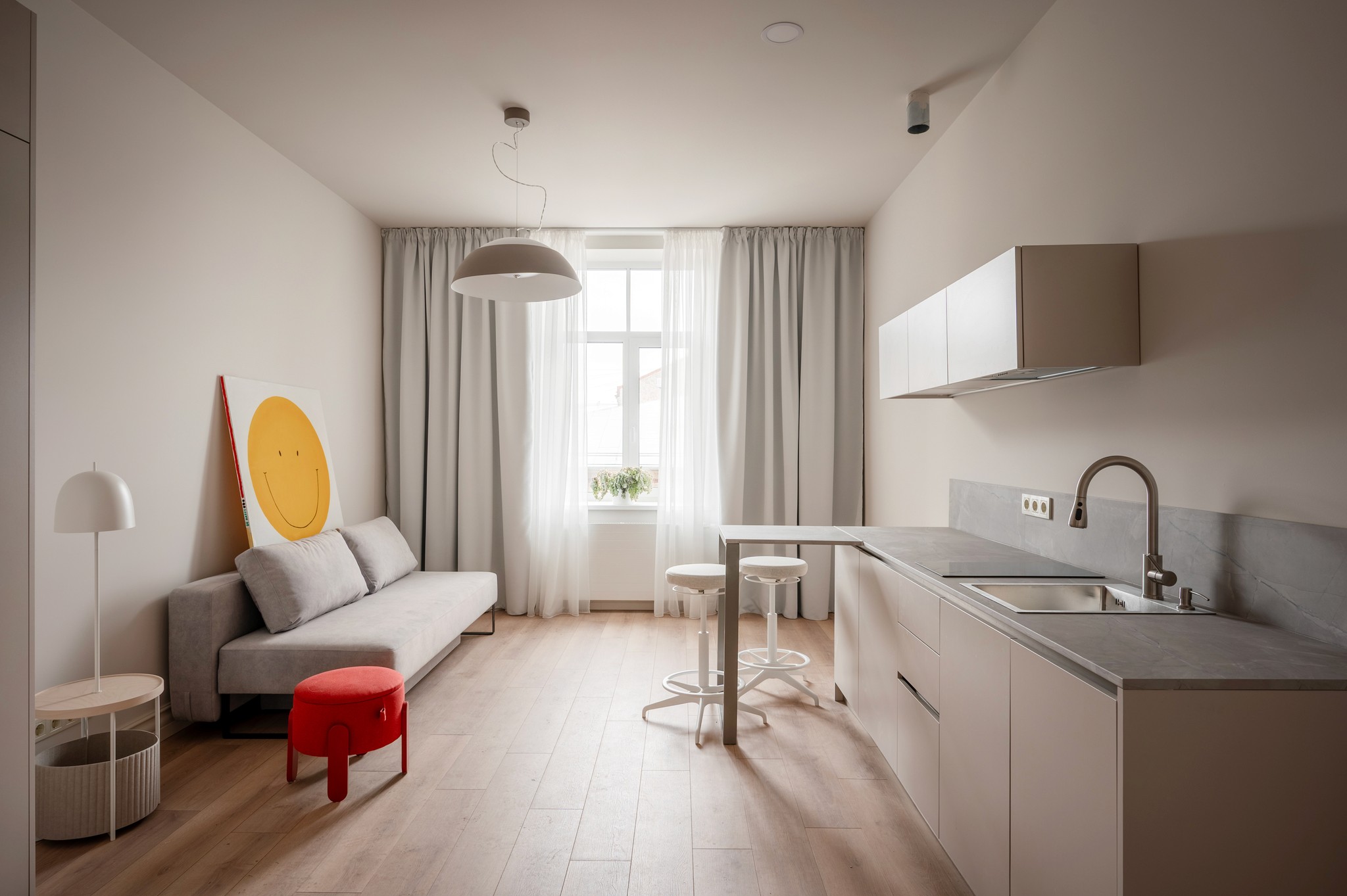 A tranquil view of a luxurious villa with a pool overlooking a serene lake, surrounded by lush greenery.