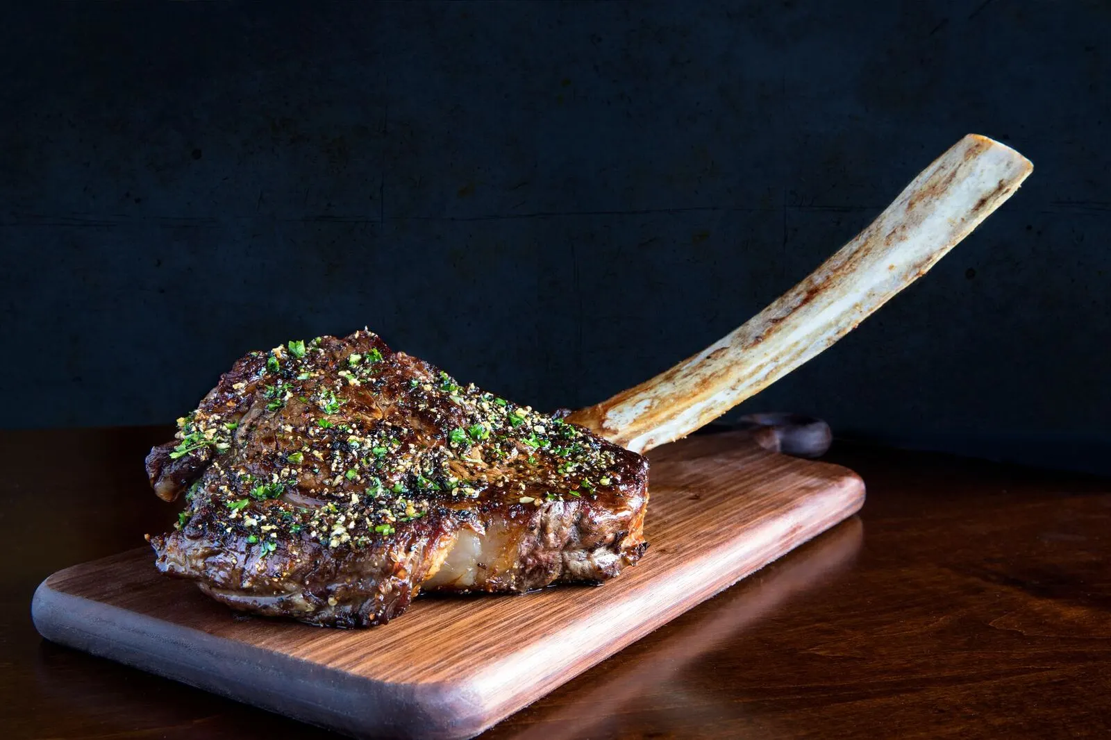 Tomahawk ribeye on a wooden board