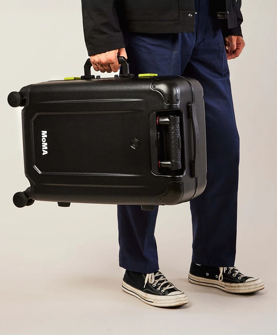 MoMA logo detail on sustainable Solgaard luggage colorway