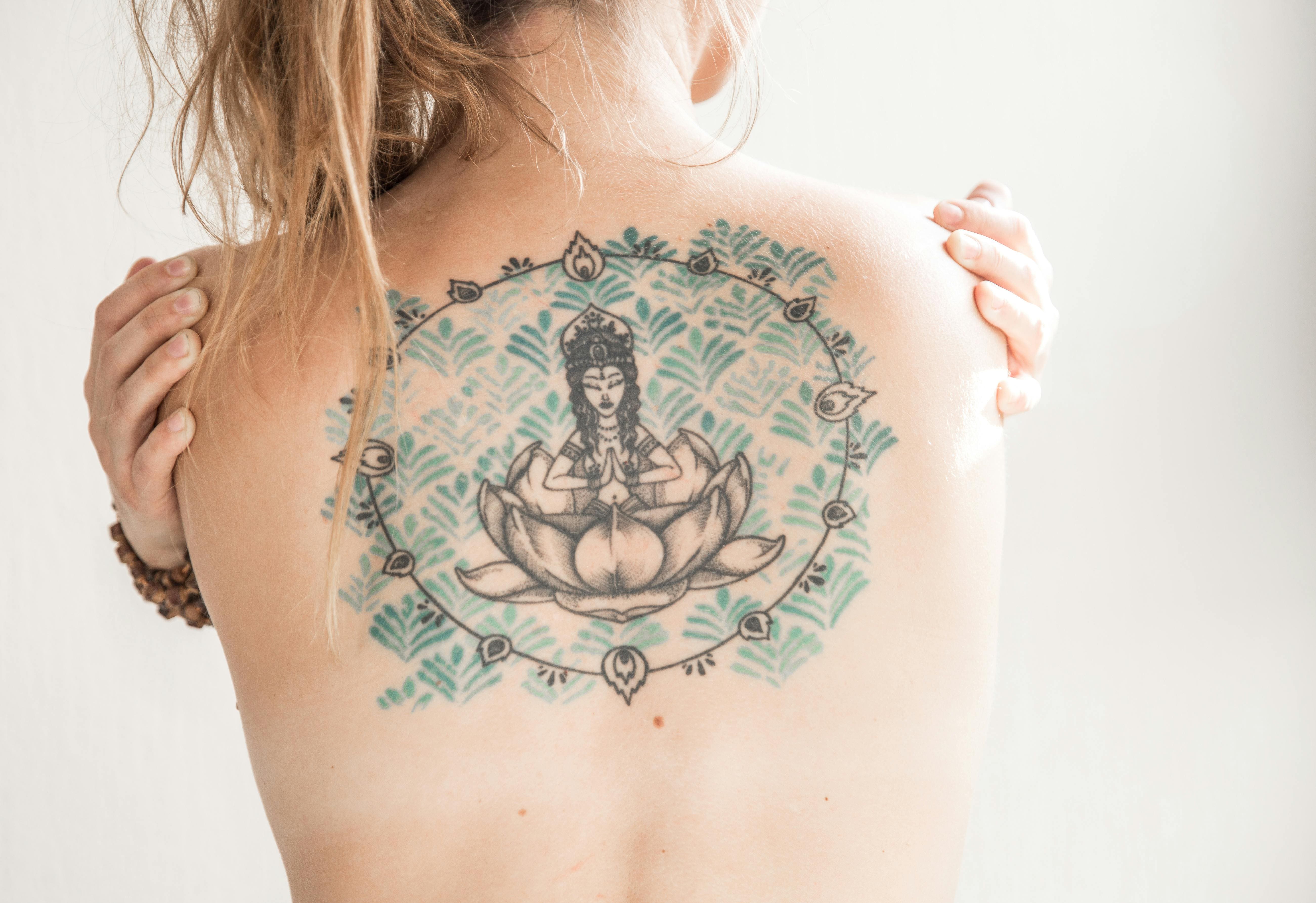Back tattoo colorful lotus flower