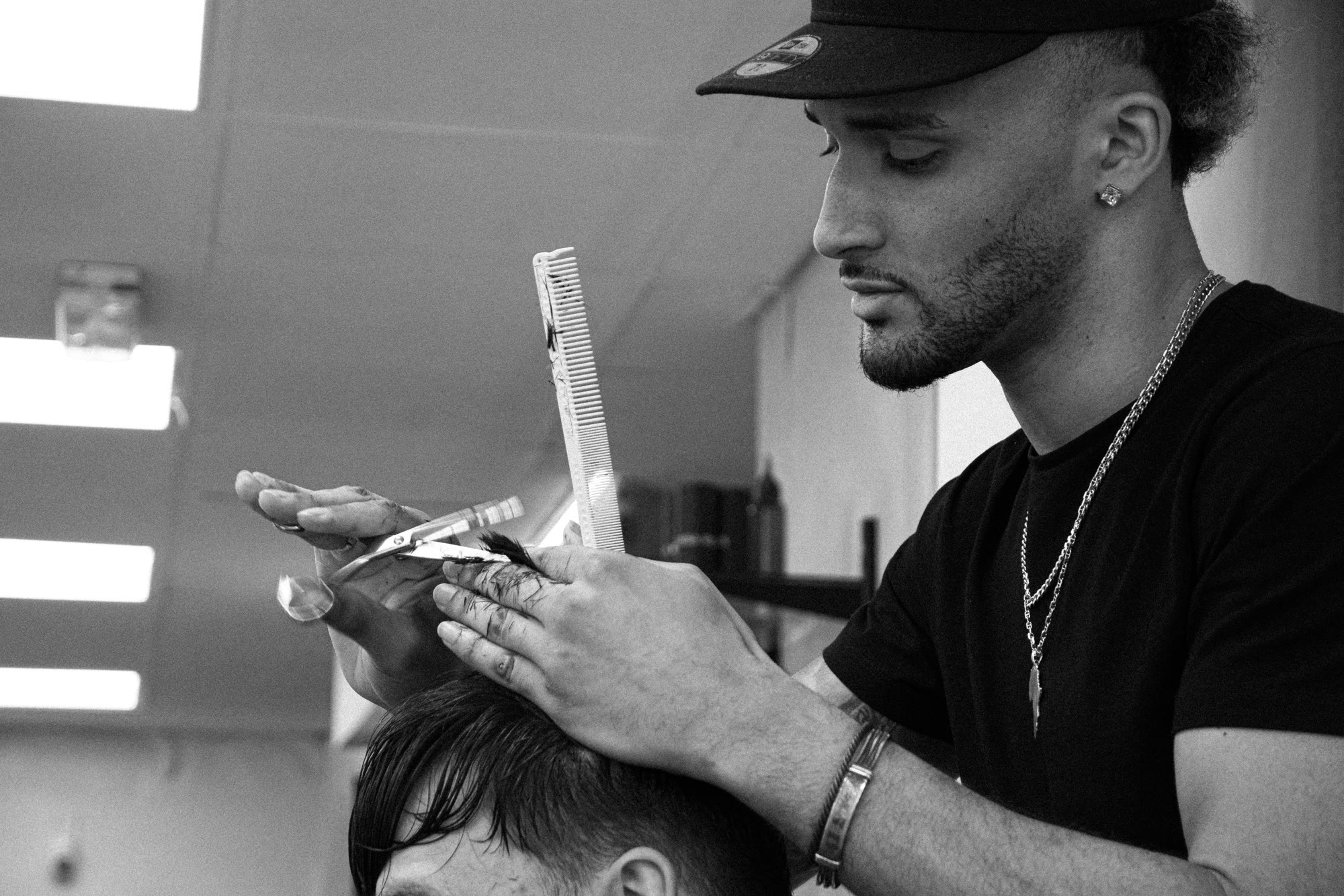 Samba the barber cutting hair.