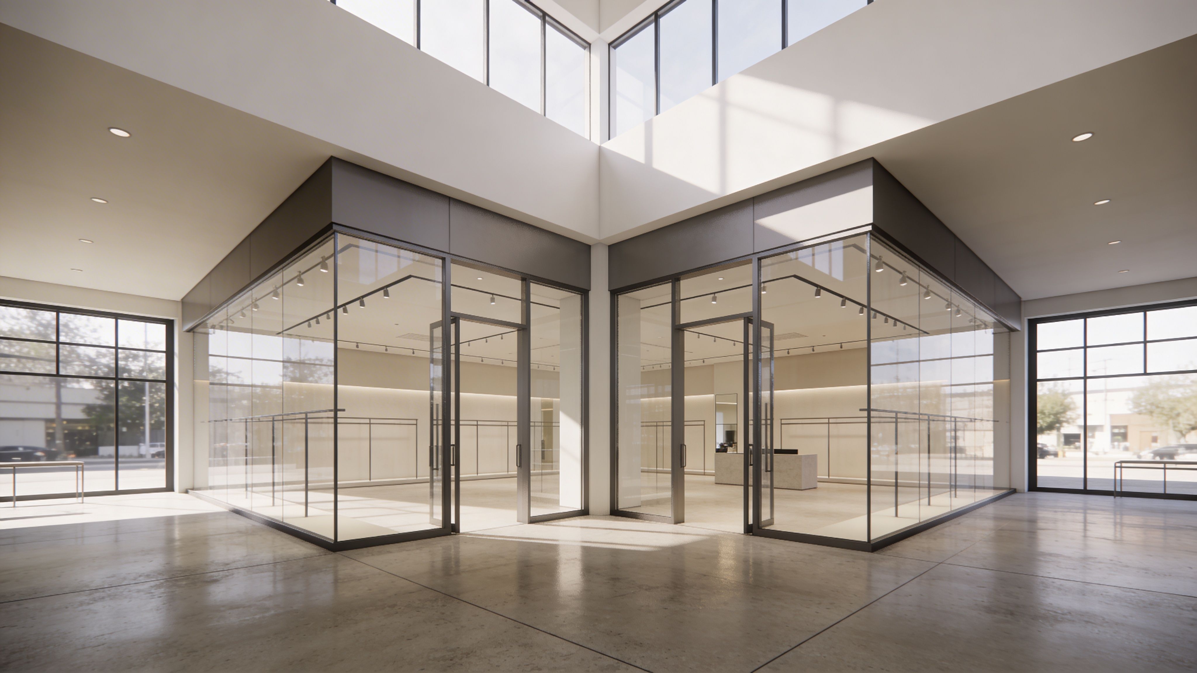 Modern retail space with glass-walled storefront units, high ceiling, and abundant natural light