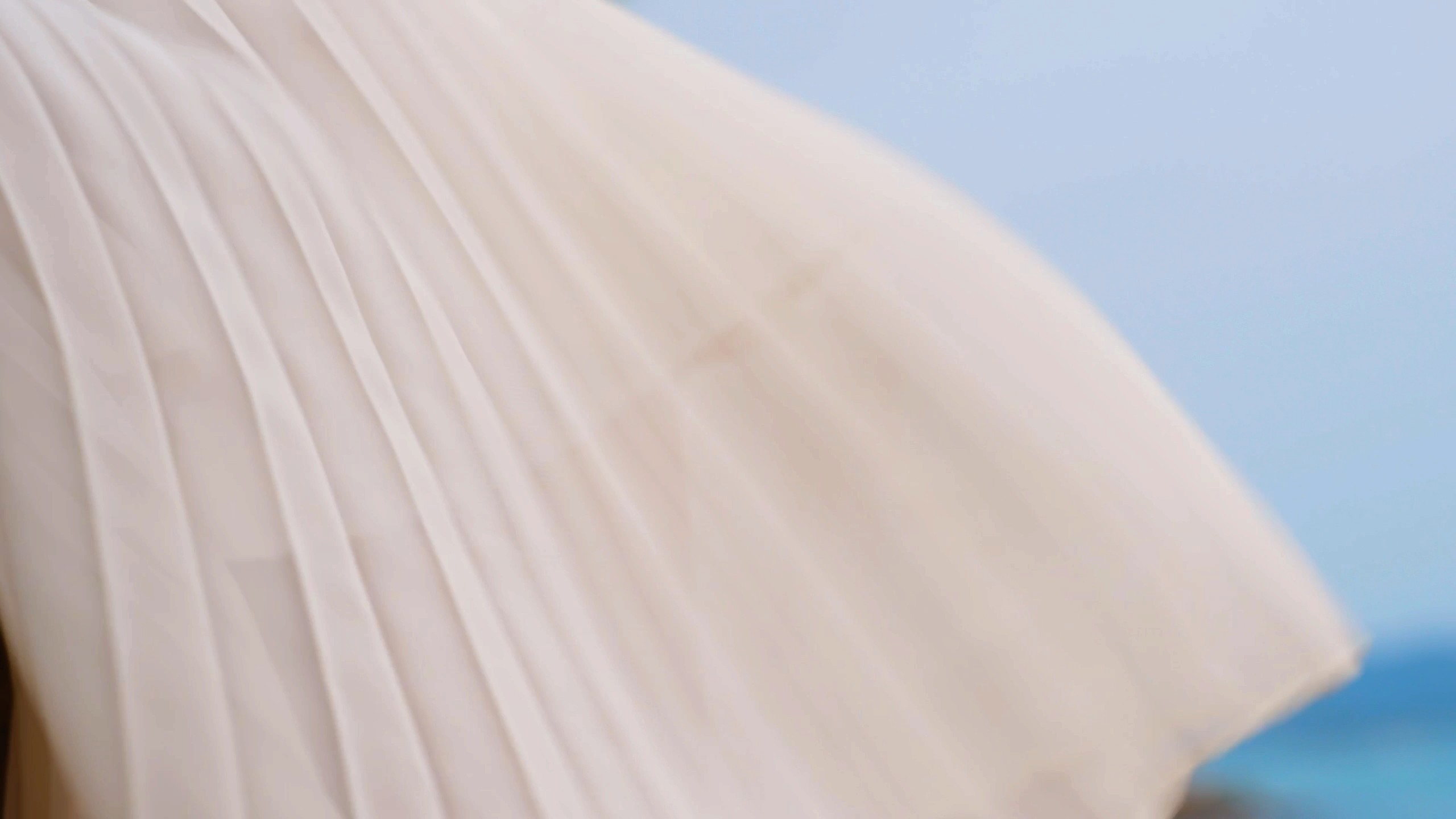 the skirts is moving by the wind that sister is wearing