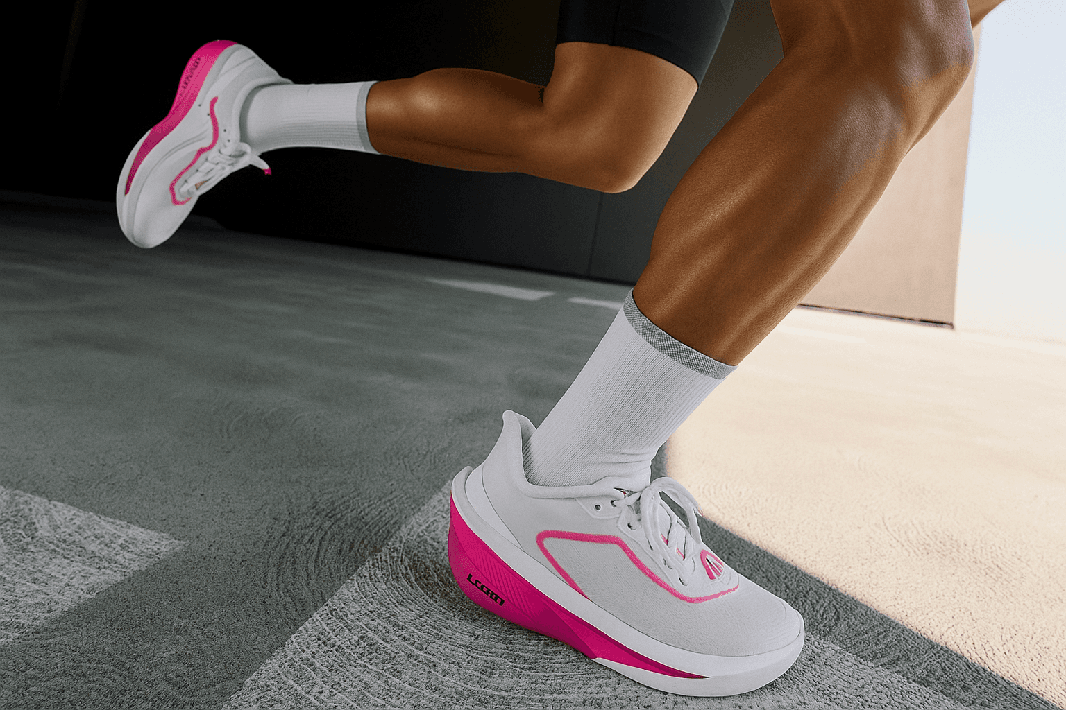 Dynamic close-up of a runner’s feet in motion, wearing white running shoes with pink accents, sprinting across a sunlit concrete track.