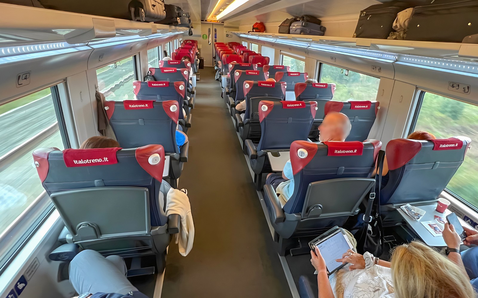 Passengers seated in Italo high-speed train from Florence to Rome.