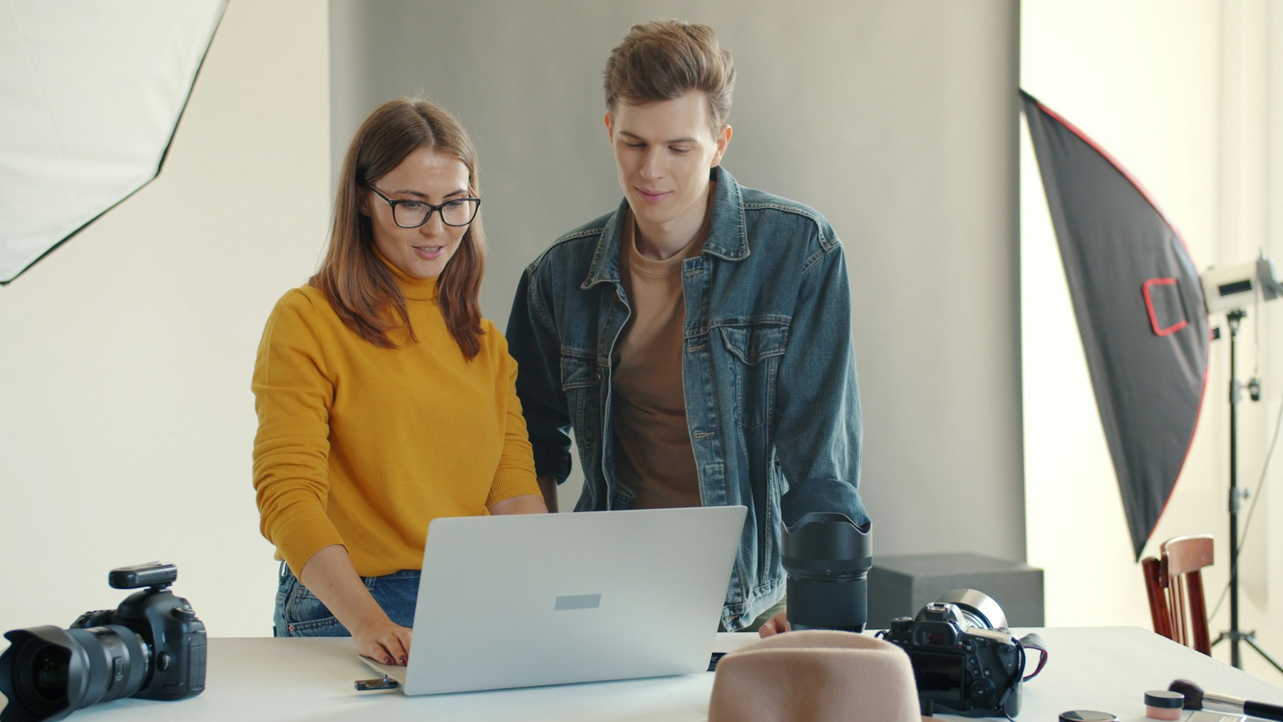 Creative collaborators reviewing a responsive digital experience together.